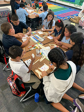 Students doing an activity on the table